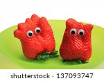 Small photo of two funny strawberry characters with jiggle eyes
