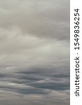 Small photo of Soft background with stratus clouds. Dramatic cloudscape under cinematic color filter.