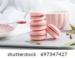Pink strawberry macarons. French delicate dessert for Breakfast in the morning light