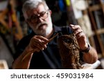 Senior Sculptor Working On His...