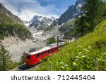 A Red Train In European Alps ...