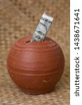 Small photo of Kids piggy bank or coin stack jar for money savings cash deposit for future. 500 rupee banknote India. Profit from business. New Indian currency.