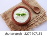Small photo of Homemade yogurt or Indian dahi. Curd in clay pot made from cow milk. Sour cream or natural Cottage cheese