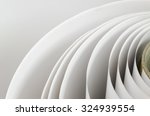 Top shot macro Paper roll swirl in a printshop, horizontal