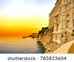 View of the historic stone colorful building Oceanographic Museum on a background of sunset sky. Monte Carlo, Monaco