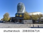 Small photo of Bordeaux, France - 7 Nov, 2021: Modern architecture of the Cite du Vin wine museum building in Bordeaux, France