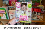 Small photo of San Francisco, USA - August 2019: Hand holding a copy of Popstar magazine with Billy Eilish on cover