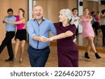 Happy older couple performing a ...