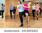 Small photo of young girl with guy dances inspiring and energetic jive dance