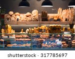 Modern bakery with assortment of bread, cakes and buns 