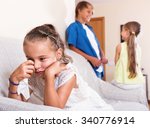 Small photo of Morose little girl is jealous sister of stepbrother indoors