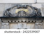 Small photo of Plauen, Germany - March 16, 2023: Old relief with cornucopia, heads of dog and cat and floral motif, above the entrance to the Sparkasse (Savings bank) in Plauen, Vogtland, Saxony.