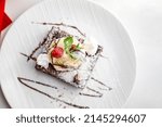 Small photo of Chocolate Brownie A La Mode Dessert in Italian Restaurant