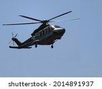 Flying helicopters in the sky. Helicopter for passenger transportation to oil and gas industry.