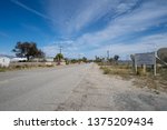 Small photo of Salton Sea Beach, California - March 21, 2019: Street going through the main drag in the small town in Imperial County, along the west side of the Salton Sea