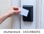 Woman hand openning hotel door with card