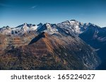 Mountain range with glaciers and blue sky in fall