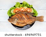 Fried Fish With Vegetable On...