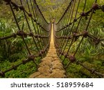 Rope Bridge Over A  River In...