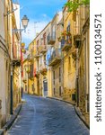 Small photo of View of a narrow street in Enna, Sicily, Italy