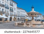 Small photo of Evora, Portugal, June 14, 2021: People are enjoying a suny day at Praca do Giraldo square in Evora, Portugal.