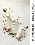 Small photo of Various vegan plant based milk and ingredients, top view, copy space. Dairy free, lactose free nut and grains milk, substitute drink, healthy eating.