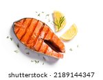 Grilled salmon fish steak isolated on white background. Roasted salmon piece - healthy food ingredient.