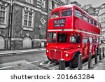 Londoner red double decker vintage bus in a street, selective color