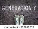 Text Generation Y written on asphalt with shoes