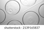 Small photo of Grayscale top view macro shot of transparent drops are falling into transparent liquid in multiple petri dishes lying around droppers | Abstract skin care cosmetics formulating concept