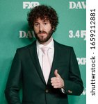 Small photo of Los Angeles, CA - Feb 27, 2020: David Andrew Burd aka Lil Dicky attends the premiere of FXX's "Dave" at Directors Guild Of America