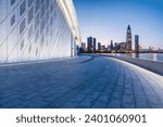 Small photo of Empty square floor and brick wall buildings with city skyline in Shenzhen at night, China.