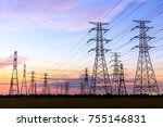 High voltage power tower landscape at sunset