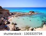 Small photo of Main view of "Es calo d'es mort" beach, one of the most beautiful spots in Formentera, Balearic Islands, Spain.