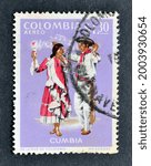 Small photo of Colombia - circa 1971 : Cancelled postage stamp printed by Colombia, that shows Costumes and folk tunes of Cumbia, circa 1971.