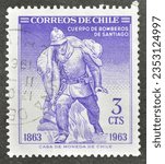 Small photo of Chile - circa 1963 : Cancelled postage stamp printed by Chile, that shows Fireman carrying woman, 100 Anniversary Santiago Fire Brigade, circa 1963.