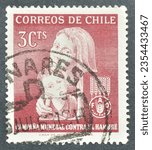 Small photo of Chile - circa 1963 : Cancelled postage stamp printed by Chile, that shows Mother and Child, FAO “Freedom from Hunger” campaign, circa 1963.