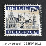 Small photo of Belgium - circa 1971 : Cancelled postage stamp printed by Belgium, that shows City Hall and statue, Malines - Mechelen, circa 1971.