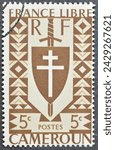 Small photo of Cameroon - circa 1942 : Cancelled postage stamp printed by Cameroon, that shows Lorraine Cross and Joan of Arc's Shield, circa 1942.
