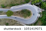 Small photo of Medium altitude aerial photo hairpin turn also called hairpin bend hairpin corner named for its resemblance to hairpin bobby pin is bend in road with a very acute inner angle vehicles driving up