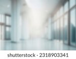 Light blurred background. The hall of an office or medical institution with panoramic windows and a perspective. 