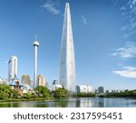 Small photo of Wonderful view of park and skyscraper at downtown of Seoul, South Korea. Amazing modern tower is visible on blue sky background. Scenic cityscape. Seoul is a popular tourist destination of Asia.