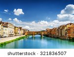 View of medieval stone bridge Ponte Vecchio and the Arno River from the Ponte Santa Trinita (Holy Trinity Bridge) in Florence, Tuscany, Italy. Florence is a popular tourist destination of Europe.