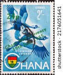 Small photo of GHANA - CIRCA 1965: a postage stamp from GHANA, showing a bird Black Crowned Crane (Balearica pavonina). overprint. Circa 1965