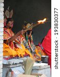Small photo of LIJIANG, CHINA - SEPTEMBER 19: Unidentified lamas recite sutras to expiate the soul of the dead during a cremation ceremony of Mosuo Minority People, September 19, 2013, Yongning, Lijiang, China
