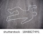 Crime scene chalk line of an auto accident with tire skid marks leading over the body.