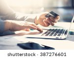 Photo businessman working with generic design notebook. Online payments, banking, hands keyboard. Blurred background, film effect. horizontal mockup