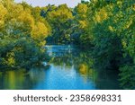 Scenic view of a river featuring lush vegetation. Arga River, Pamplona, Spain
