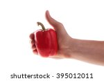 Small photo of Red pepper on a white background. In the men's hand. pollex