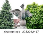 Small photo of RABA WYZNA, POLAND - MAY 26, 2023: A statue of a mighty eagle, the defender of the nation, who can peck any enemy, especially from the east.